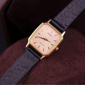 Vtg 1997 Seiko Exceline 2J41-5000 20mm Women’s Watch
Gold Textured Linen Dial